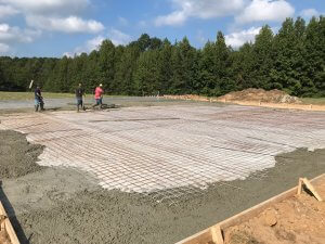 Oconee workers laying down a concrete foundation in Macon, GA